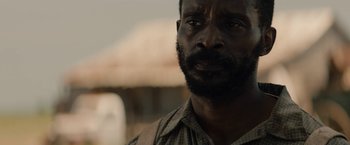 Movie still from “Mudbound” (2017), directed by Dee Rees – A person with a beard; Close Up shot, Over the shoulder angle