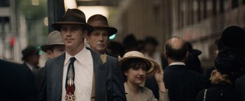 Movie still from “Mudbound” (2017), directed by Dee Rees – A group of people wearing hats and suits; Close Up shot, Over the shoulder angle