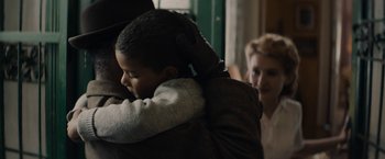 Movie still from “Mudbound” (2017), directed by Dee Rees – A woman holding a child in her arms; Close Up shot, Over the shoulder angle