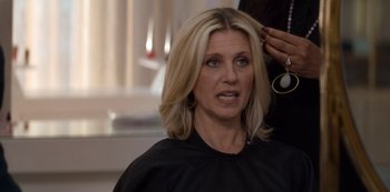 Movie still from “Murder Mystery” (2019), directed by Kyle Newacheck – A woman getting her hair cut by a stylist; Close Up shot, Over the shoulder angle