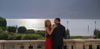 Movie still from “Murder Mystery” (2019), directed by Kyle Newacheck – A man and a woman are dancing on a balcony; Wide shot, High angle