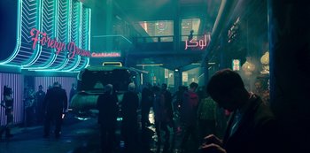 Movie still from “Mute” (2018), directed by Duncan Jones – A group of people standing in the middle of a street; Wide shot, Low angle
