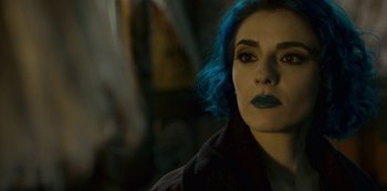 Movie still from “Mute” (2018), directed by Duncan Jones – A person with blue hair; Close Up shot, Over the shoulder angle
