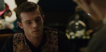 Movie still from “Mute” (2018), directed by Duncan Jones – A young man is sitting in front of a mirror; Close Up shot, Over the shoulder angle