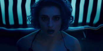 Movie still from “Mute” (2018), directed by Duncan Jones – A person with blue hair; Close Up shot, Overhead angle