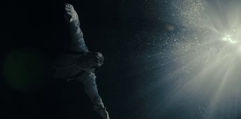 Movie still from “Mute” (2018), directed by Duncan Jones – A man flying through the night sky while holding his arms out; Medium shot, Overhead angle