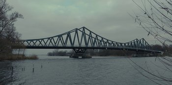 A bridge over a body of water near a body of water