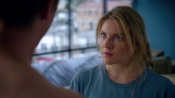 Movie still from “Narcos” (2015), created by Chris Brancato – A young woman is looking at the camera; Close Up shot, Over the shoulder angle