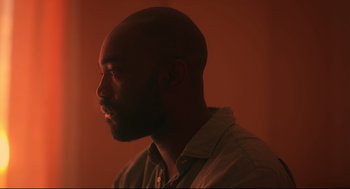 Movie still from “Men” (2022), directed by Alex Garland – A person with a beard; Close Up shot, Low angle