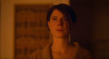 Movie still from “Men” (2022), directed by Alex Garland – A person wearing a sweater; Close Up shot, Low angle