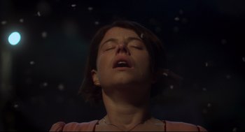 Movie still from “Men” (2022), directed by Alex Garland – A woman with her eyes closed and her mouth open; Close Up shot, Low angle