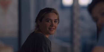 Movie still from “Midsommar” (2019), directed by Ari Aster – A young woman is smiling for the camera; Close Up shot, Over the shoulder angle