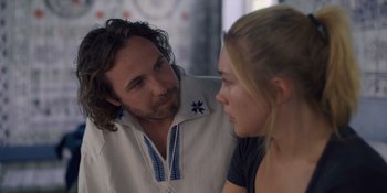 Movie still from “Midsommar” (2019), directed by Ari Aster – A man and a woman are looking at each other; Close Up shot, Over the shoulder angle