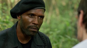 Movie still from “Narcos” (2015), created by Chris Brancato – A person wearing a hat; Close Up shot, Over the shoulder angle