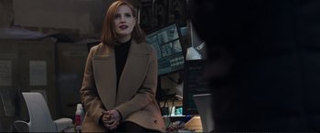 Movie still from “Miss Sloane” (2016), directed by John Madden – A woman sitting in front of computer monitors; Medium shot, Over the shoulder angle
