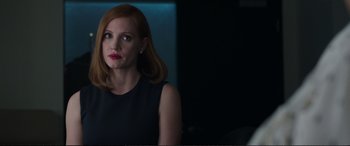 Movie still from “Miss Sloane” (2016), directed by John Madden – Jessica chastain wearing a black dress; Close Up shot, Over the shoulder angle