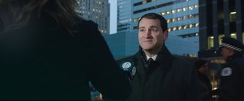 Movie still from “Miss Sloane” (2016), directed by John Madden – A man in a black jacket is talking to a woman; Close Up shot, Over the shoulder angle