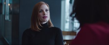 Movie still from “Miss Sloane” (2016), directed by John Madden – A person sitting in a room; Close Up shot, Over the shoulder angle