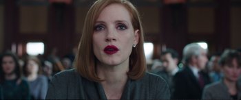 Movie still from “Miss Sloane” (2016), directed by John Madden – A person wearing a jacket; Close Up shot, Over the shoulder angle