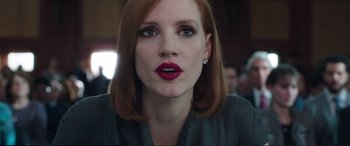 Movie still from “Miss Sloane” (2016), directed by John Madden – A person with red lipstick; Close Up shot, Over the shoulder angle