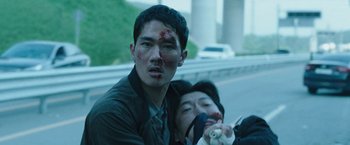 Movie still from “Night in Paradise” (2020), directed by Park Hoon-jung – A man with blood all over his face and another man with blood all over his face; Close Up shot, Low angle