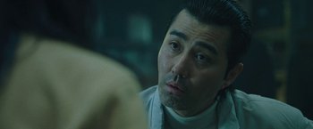 Movie still from “Night in Paradise” (2020), directed by Park Hoon-jung – A person looking at a mirror; Close Up shot, Low angle