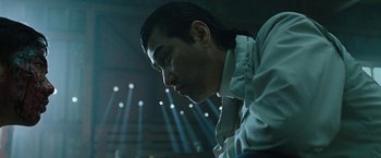 Movie still from “Night in Paradise” (2020), directed by Park Hoon-jung – A person with long hair; Close Up shot, Low angle