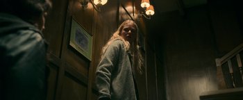 Movie still from “No One Gets Out Alive” (2021), directed by Santiago Menghini – Medium shot, Low angle