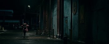 Movie still from “No One Gets Out Alive” (2021), directed by Santiago Menghini – A fire hydrant in front of a building; Extreme Wide shot, Low angle