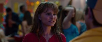 Movie still from “No Strings Attached” (2011), directed by Ivan Reitman – A woman with long brown hair wearing a red shirt; Close Up shot, Over the shoulder angle