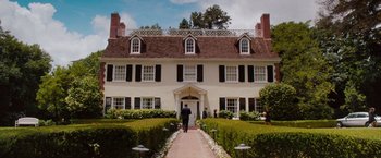 Movie still from “No Strings Attached” (2011), directed by Ivan Reitman – A man walking down a path in front of a white house; Extreme Wide shot, Low angle