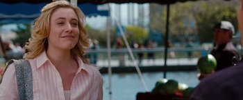 Movie still from “No Strings Attached” (2011), directed by Ivan Reitman – A woman standing in front of a building; Close Up shot, Over the shoulder angle