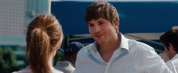 Movie still from “No Strings Attached” (2011), directed by Ivan Reitman – A young man talking to a woman in a white shirt; Close Up shot, Over the shoulder angle