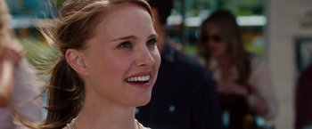 Movie still from “No Strings Attached” (2011), directed by Ivan Reitman – A person with a smile on their face; Close Up shot, Over the shoulder angle