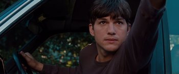 Movie still from “No Strings Attached” (2011), directed by Ivan Reitman – A person wearing a brown shirt; Close Up shot, Over the shoulder angle