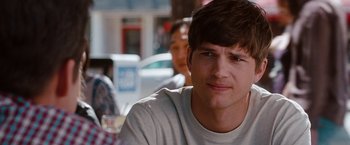 Movie still from “No Strings Attached” (2011), directed by Ivan Reitman – A person sitting at a table; Close Up shot, Over the shoulder angle