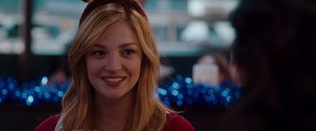 Movie still from “No Strings Attached” (2011), directed by Ivan Reitman – A person smiling for the camera; Close Up shot, Over the shoulder angle