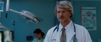 Movie still from “No Strings Attached” (2011), directed by Ivan Reitman – A man with a stethoscope around his neck; Close Up shot, Low angle