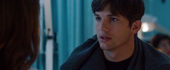 Movie still from “No Strings Attached” (2011), directed by Ivan Reitman – A person wearing a sweater; Close Up shot, Over the shoulder angle
