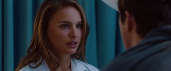 Movie still from “No Strings Attached” (2011), directed by Ivan Reitman – A person wearing a white shirt; Close Up shot, Over the shoulder angle