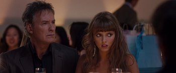 Movie still from “No Strings Attached” (2011), directed by Ivan Reitman – A man and a woman looking at each other in front of a crowd; Close Up shot, Over the shoulder angle