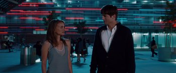 Movie still from “No Strings Attached” (2011), directed by Ivan Reitman – A man and a woman are standing in the street; Medium shot, Over the shoulder angle
