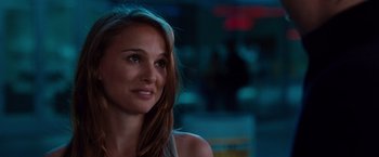 Movie still from “No Strings Attached” (2011), directed by Ivan Reitman – A beautiful young lady with long brown hair and green eyes; Close Up shot, Over the shoulder angle