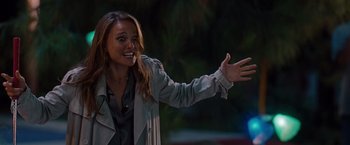 Movie still from “No Strings Attached” (2011), directed by Ivan Reitman – A beautiful young lady holding out her hand; Medium shot, Over the shoulder angle