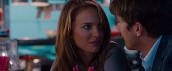 Movie still from “No Strings Attached” (2011), directed by Ivan Reitman – A person sitting down; Close Up shot, Over the shoulder angle