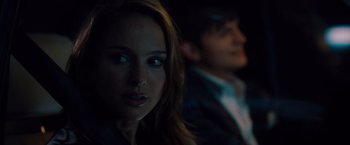 Movie still from “No Strings Attached” (2011), directed by Ivan Reitman – A woman and a man in a dark room; Close Up shot, Over the shoulder angle