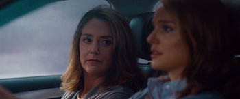 Movie still from “No Strings Attached” (2011), directed by Ivan Reitman – A woman sitting next to another woman in a car; Close Up shot, Over the shoulder angle