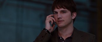 Movie still from “No Strings Attached” (2011), directed by Ivan Reitman – A young man is talking on a cell phone; Close Up shot, Over the shoulder angle