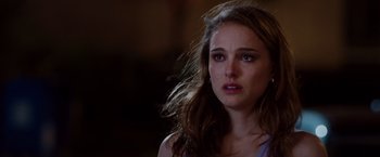 Movie still from “No Strings Attached” (2011), directed by Ivan Reitman – A person looking sad; Close Up shot, Over the shoulder angle