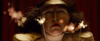 Movie still from “Nocturnal Animals” (2016), directed by Tom Ford – A person holding a sparkler in their hand; Extreme Close Up shot, Low angle